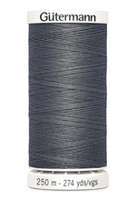 Spool of Gutermann thread on a white background