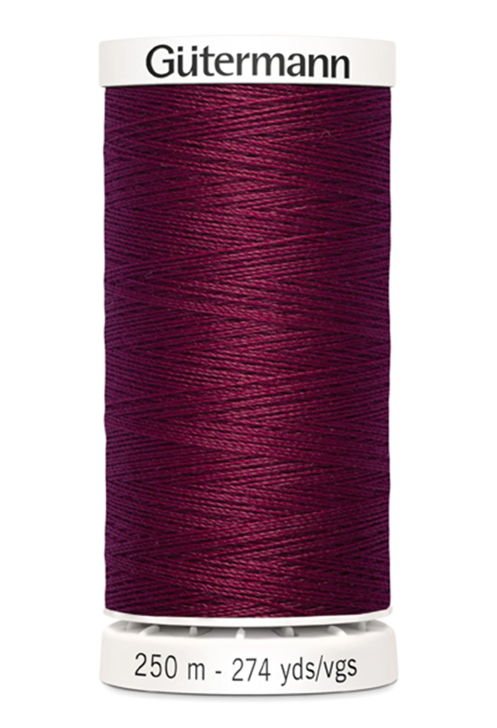 Spool of Gutermann thread on a white background