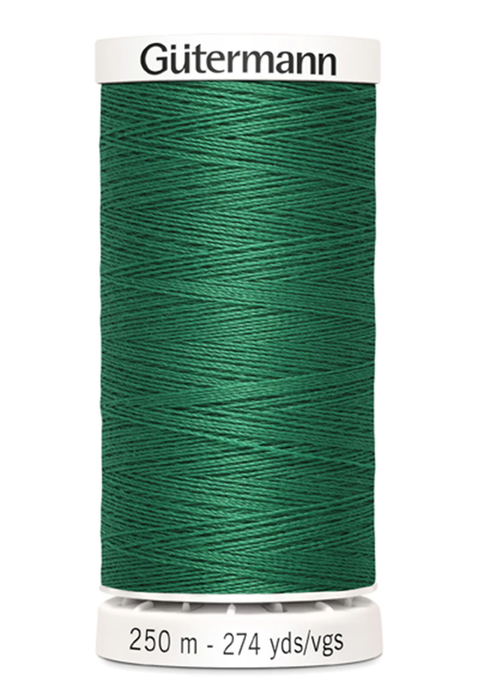 Spool of green Gutermann thread on a white background