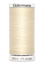 Spool of Gutermann thread on a white background