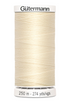 Spool of Gutermann thread on a white background
