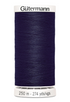 Spool of dark blue Gutermann thread on a white background