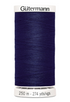 Spool of Gutermann thread on a white background