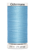 Spool of Gutermann thread in light blue on a white background