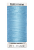 Spool of Gutermann thread in light blue on a white background