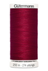 Spool of red thread with 'Gütermann' branding on a white background