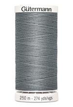 Spool of Gutermann thread on a white background