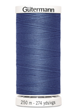 Spool of Gutermann thread on a white background