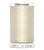 Spool of Gutermann thread on a white background