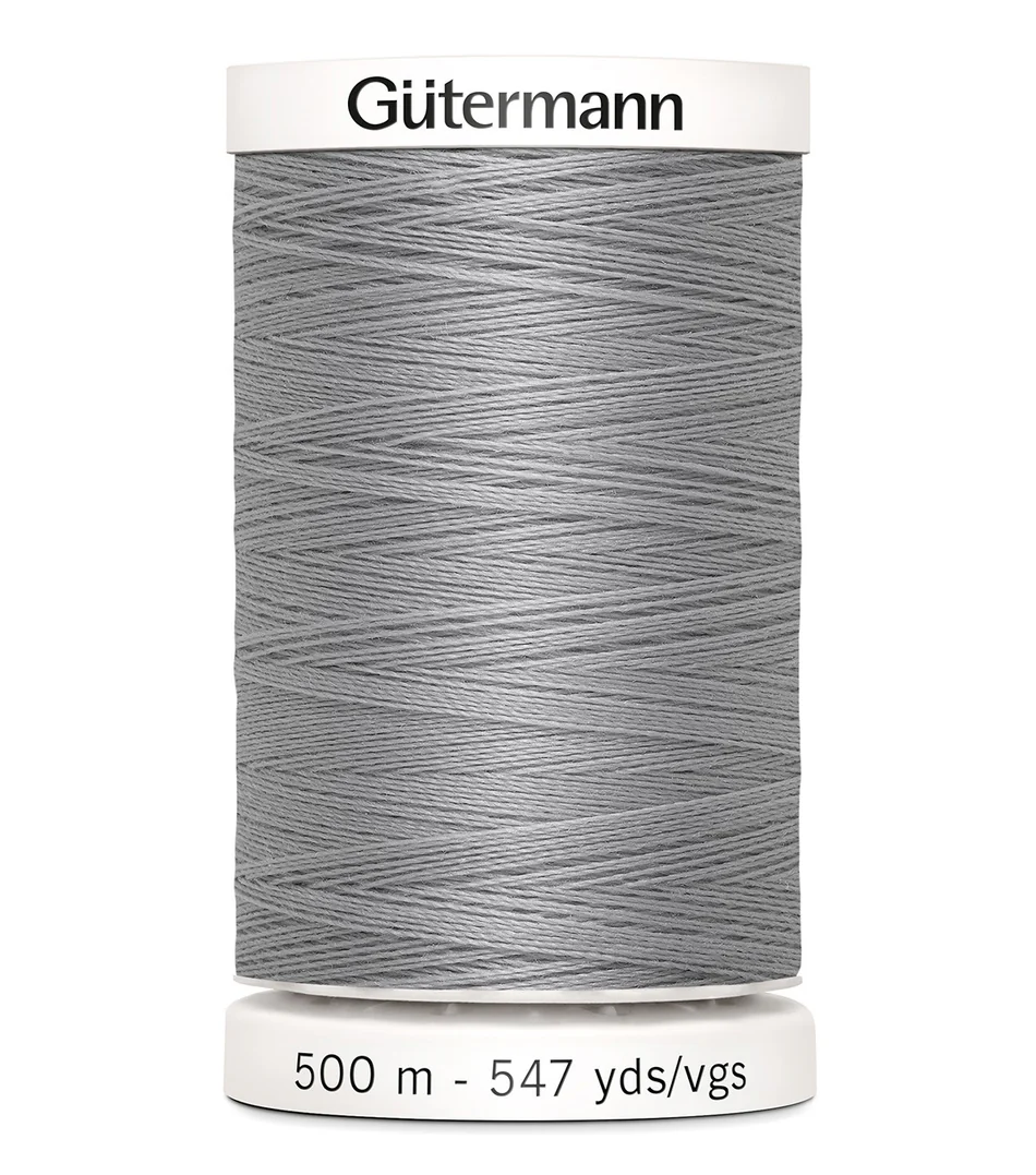 Spool of Gutermann thread on a white background