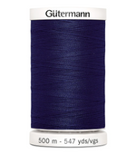 Spool of Gutermann thread in navy blue on a white background