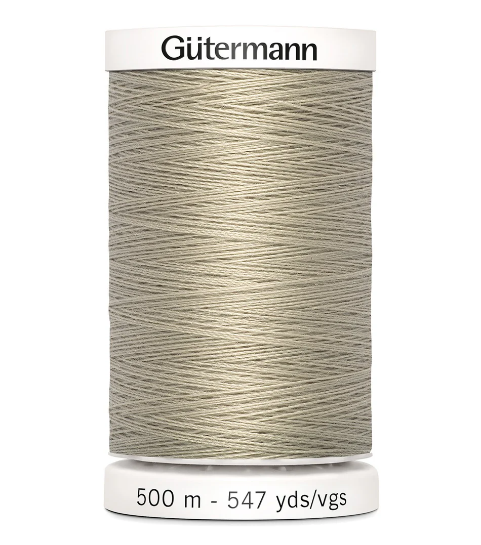 Spool of Gutermann thread on a white background