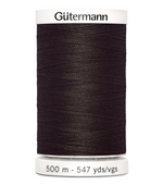Spool of Gutermann thread on a white background