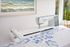 Husqvarna Viking Designer Epic 3 Nordic Frost Sewing and Embroidery Machine Angled on a Table with Embroidery Example