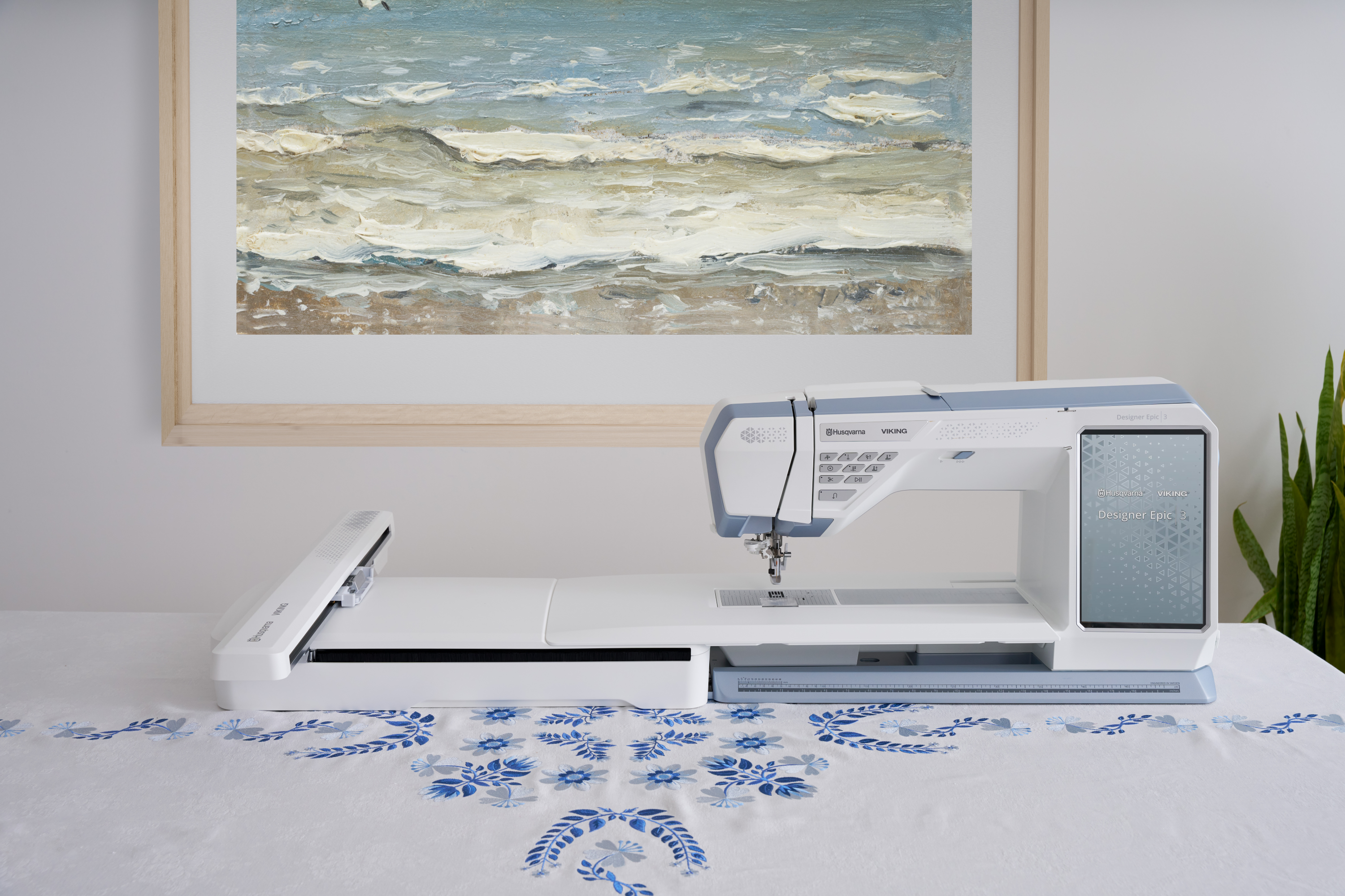Husqvarna Viking Designer Epic 3 Nordic Frost Sewing and Embroidery Machine on a Table with Embroidery Example