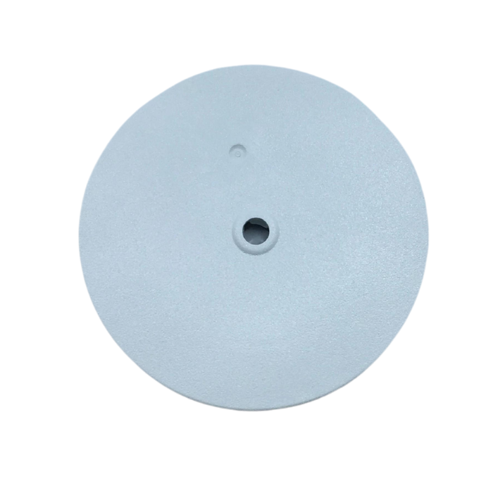 A round, light gray plastic disc with a central hole and a small dot feature near the top, isolated on a white background.