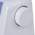 Close-up of a white circular control dial on a white sewing machine, with a small blue panel visible at the upper left edge.