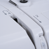 Close-up of a white sewing machine showing control dials and numbered settings including 2, 4, 5, and 6.