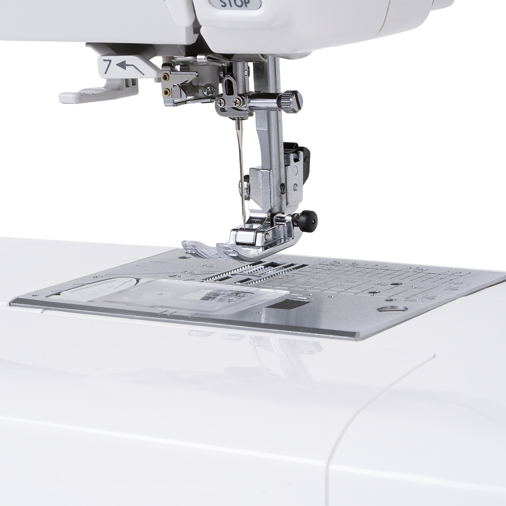 Close-up of a white sewing machine showing the needle area, presser foot, thread guide, and metal needle plate against a clean white background.