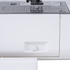 Close-up of a white sewing machine showing the front drawer cover, a small white pull switch, and part of the metallic needleplate with stitch and thread guides.