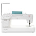 A white Janome sewing machine with a teal fabric guard and an adjustable metal arm, shown from a three-quarters angle on a white background.