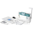 A white and teal sewing machine shown with its included accessories and parts arranged around it on a clean white background. The set includes a keyboard, presser foot, clips, thread, needles, a manual, and other small accessories.