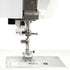 Close-up of a sewing machine presser area and metal needle plate on a white background.
