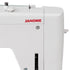 Close-up of a white Janome sewing machine showing the side panel with the red JANOME logo, metal tension adjustment components, and a small white lever on a clean white background.