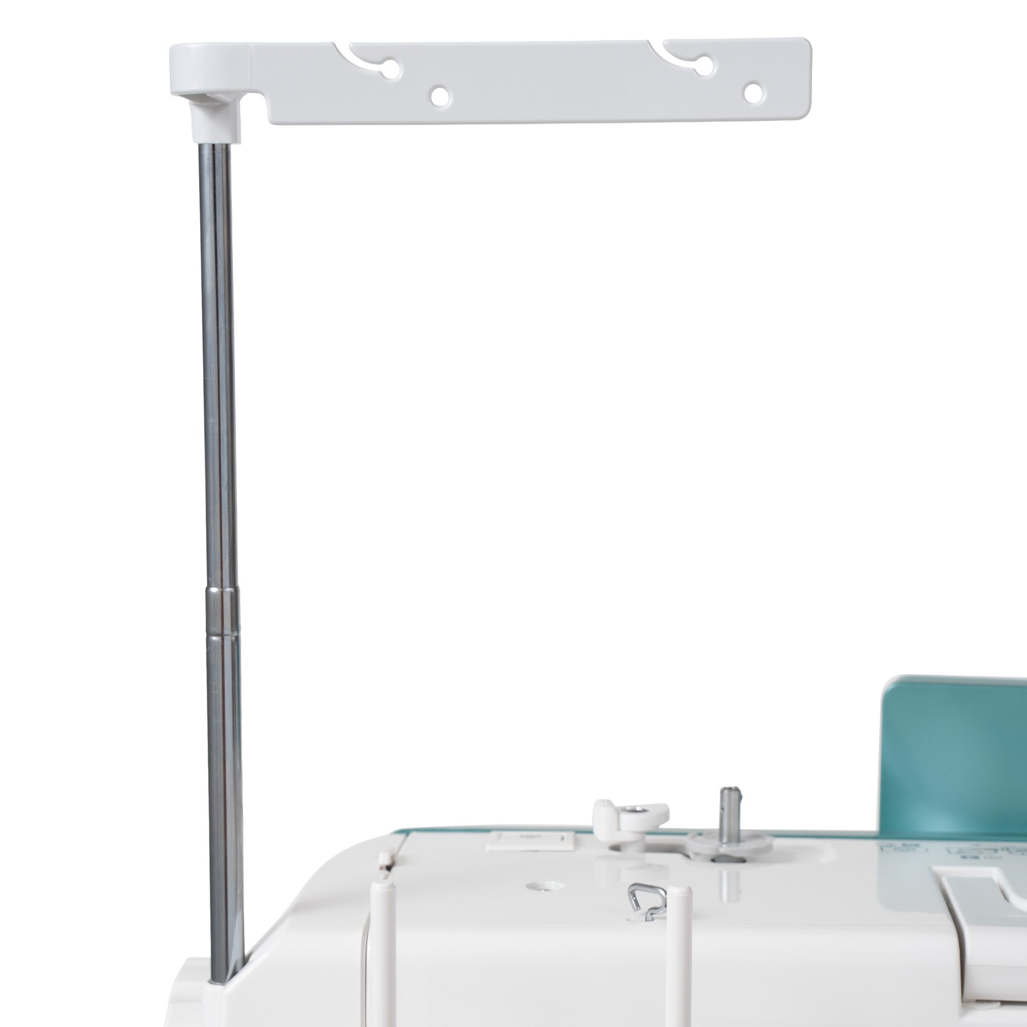 A close-up of a white and silver adjustable stand or bracket attached to the side of a white machine, with a teal panel visible in the background on a clean white studio backdrop.