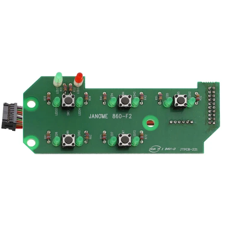A green industrial control panel module with multiple black push buttons, green and red indicator lights, and printed text reading JANOME 860-F2 on a white background.