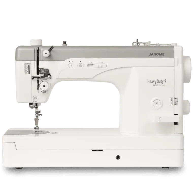 Janome Heavy Duty 9 sewing machine in white and gray, shown from a front-three-quarter angle on a clean white background.
