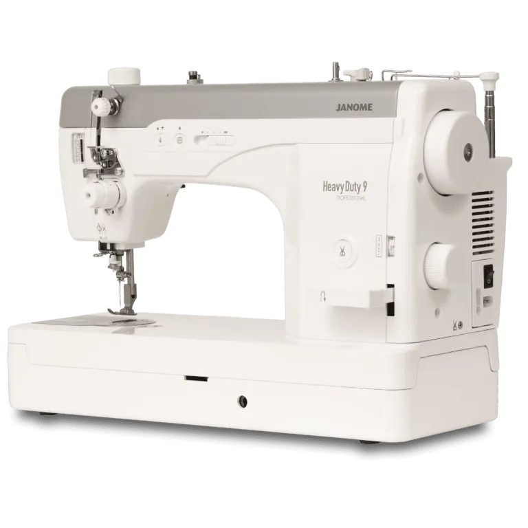 Janome Heavy Duty 9 Plus sewing machine in white and gray, shown from a three-quarter angle on a white background.