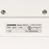 Close-up of a JANOME sewing machine nameplate showing model 767LE, 120V 60Hz 1.0A, UL listed, and made in Taiwan on a white machine surface.