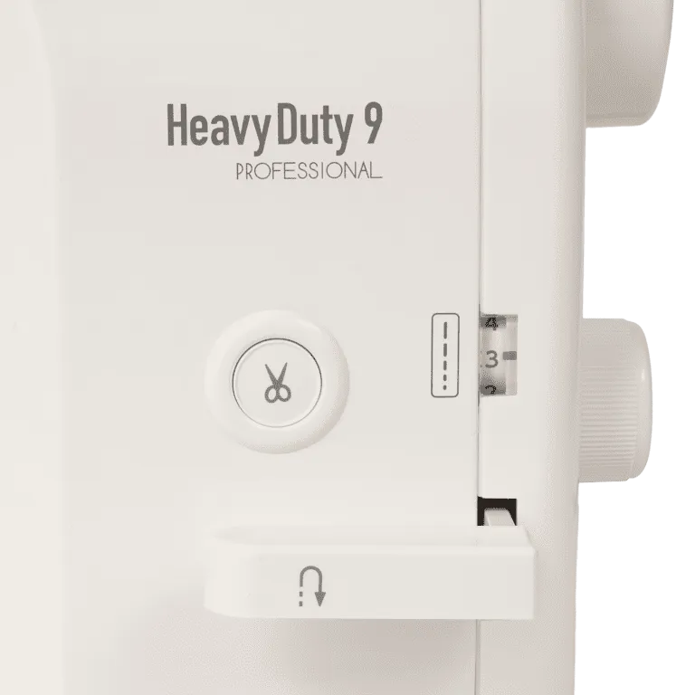 Close-up of a white sewing machine panel with the text 'Heavy Duty 9 PROFESSIONAL' and a circular button with a scissors icon.