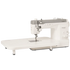 A heavy-duty sewing machine with a long flat table base, shown from a three-quarter angle on a solid white background. The machine features a white body with a gray top cover and silver metal components.