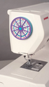 Sewing machine with a wheel attachment on a gray background