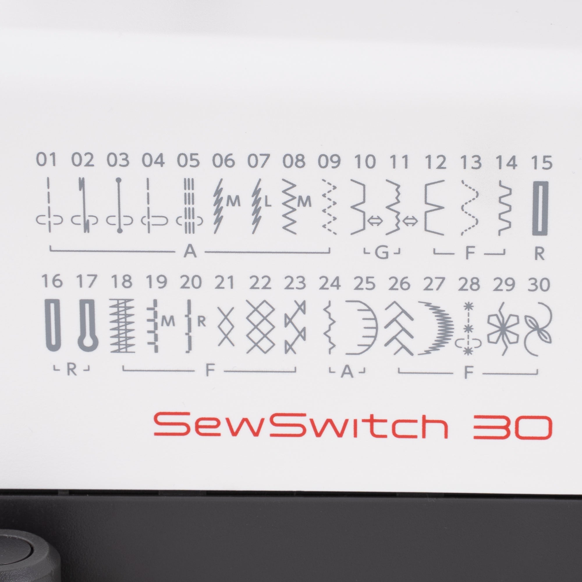 A close-up of a white sewing machine control panel showing the SewSwitch 30 stitch selector with various stitch symbols and numbers 01 to 30, plus red 'SewSwitch 30' text.