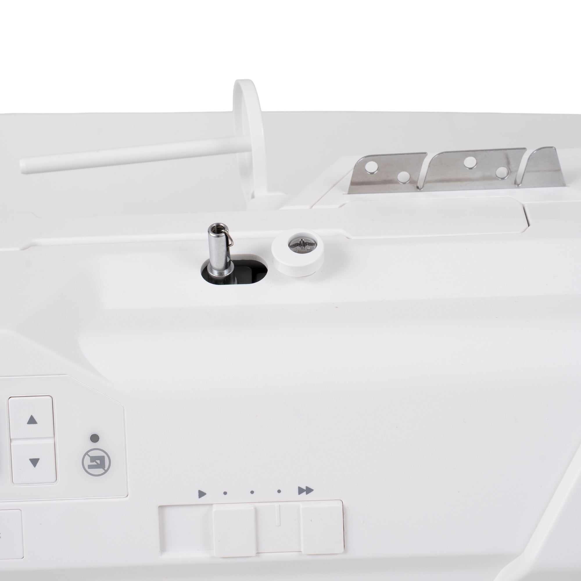 Close-up of a white sewing machine showing the top panel with thread spool, tension adjustment, metal guide plates, and control buttons on a white background.