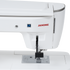 Close-up of a white Janome sewing machine showing the side panel, red Janome logo, black presser foot, and metal needle plate on a clean white background.
