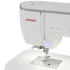 A close-up of a white Janome sewing machine showing the upper housing, control buttons, needle area, and part of the flatbed base against a clean white background.