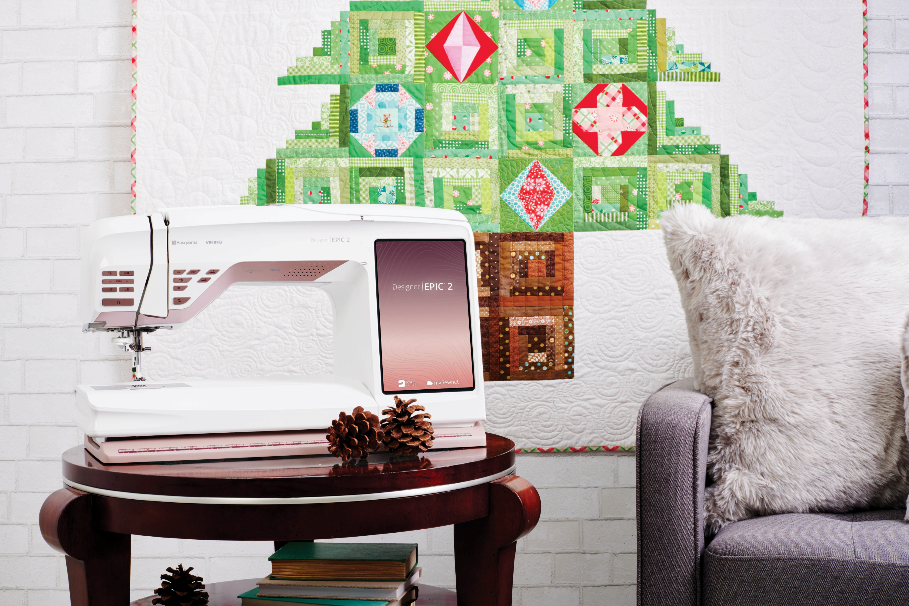 Husqvarna Viking Designer Epic 2 Sewing and Embroidery Machine on a table in a room with christmas decor