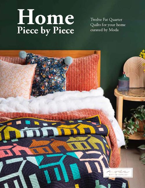 Book cover of 'Home Piece by Piece' with a colorful quilt on a bed against a green wall.