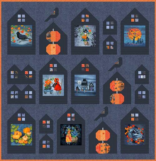 Halloween-themed quilt with houses and pumpkins on a blue background