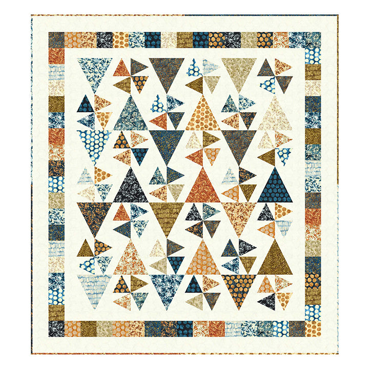 Quilt with geometric triangle pattern in various colors on a white background