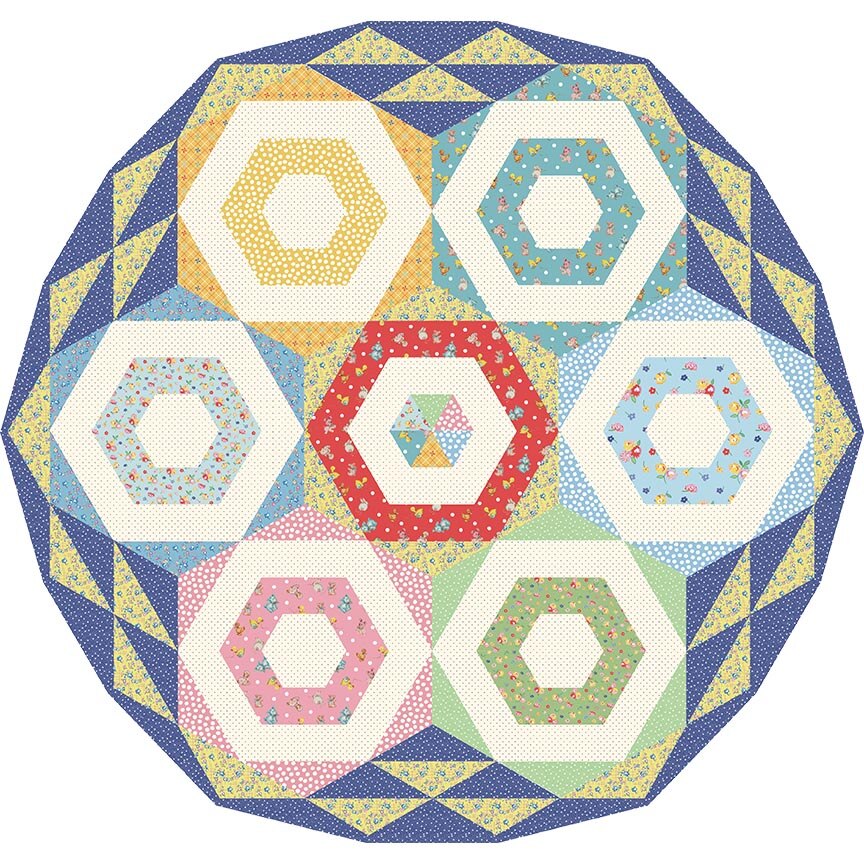 A circular quilt pattern or rug design featuring a central red hexagon surrounded by six other hexagons in pastel pink, green, blue, yellow, and cream, all set within a navy and yellow geometric border on a white background.