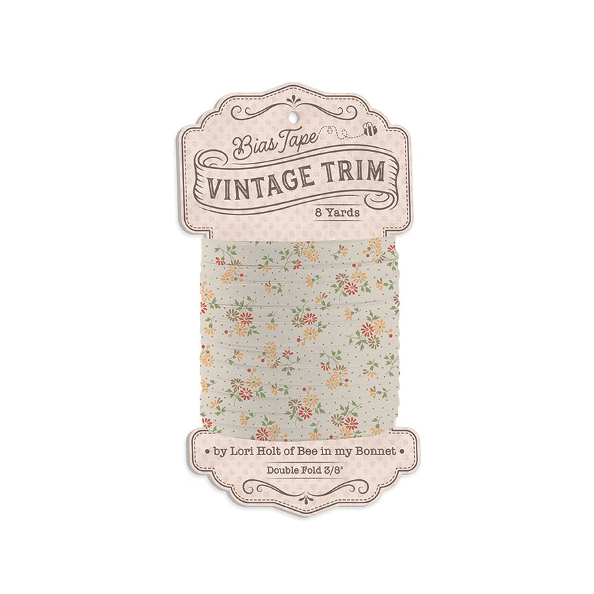 Bias Tape Vintage Trim in a floral pattern on a light beige background, packaged on a decorative paper card.