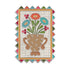 A decorative needle minder with a floral bouquet in a brown vase on a cream grid background, surrounded by a multicolored zigzag border.