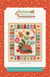 Quilt pattern packaging with colorful design and text on a floral background