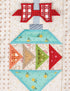 A close-up of a handcrafted quilted ornament applique featuring a red bow, light blue sections with yellow floral prints, and geometric triangle panels in orange, tan, and green on a cream patterned fabric background.