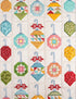 A quilted fabric panel featuring a repeating pattern of colorful Christmas ornaments in various geometric shapes and patterns, including stripes, polka dots, and floral prints, hanging from light blue hooks on a cream background.